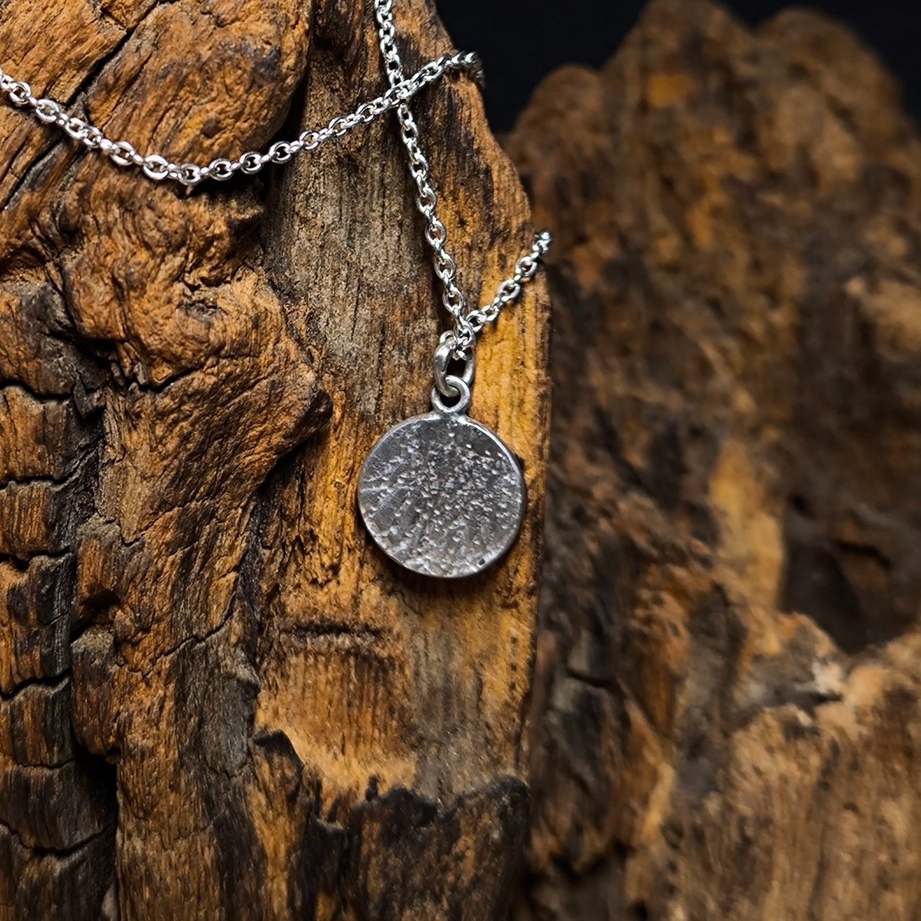 Kettenanhänger aus Silber mit dem Namen "Planet"