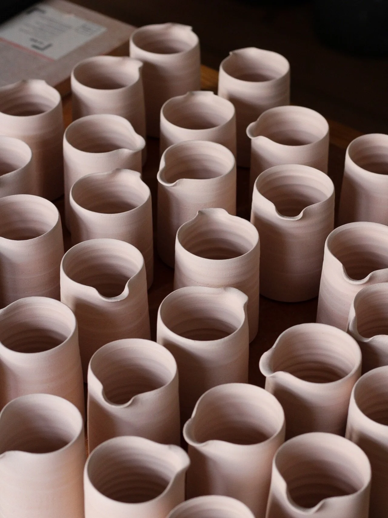 The last of the wholesale orders are leaving the studio and I&rsquo;m trimming the final batch of cups for the last bisque firing before Potfest in Glasgow next weekend! This year, I&rsquo;m switching things up: I&rsquo;ll be doing three Christmas ma