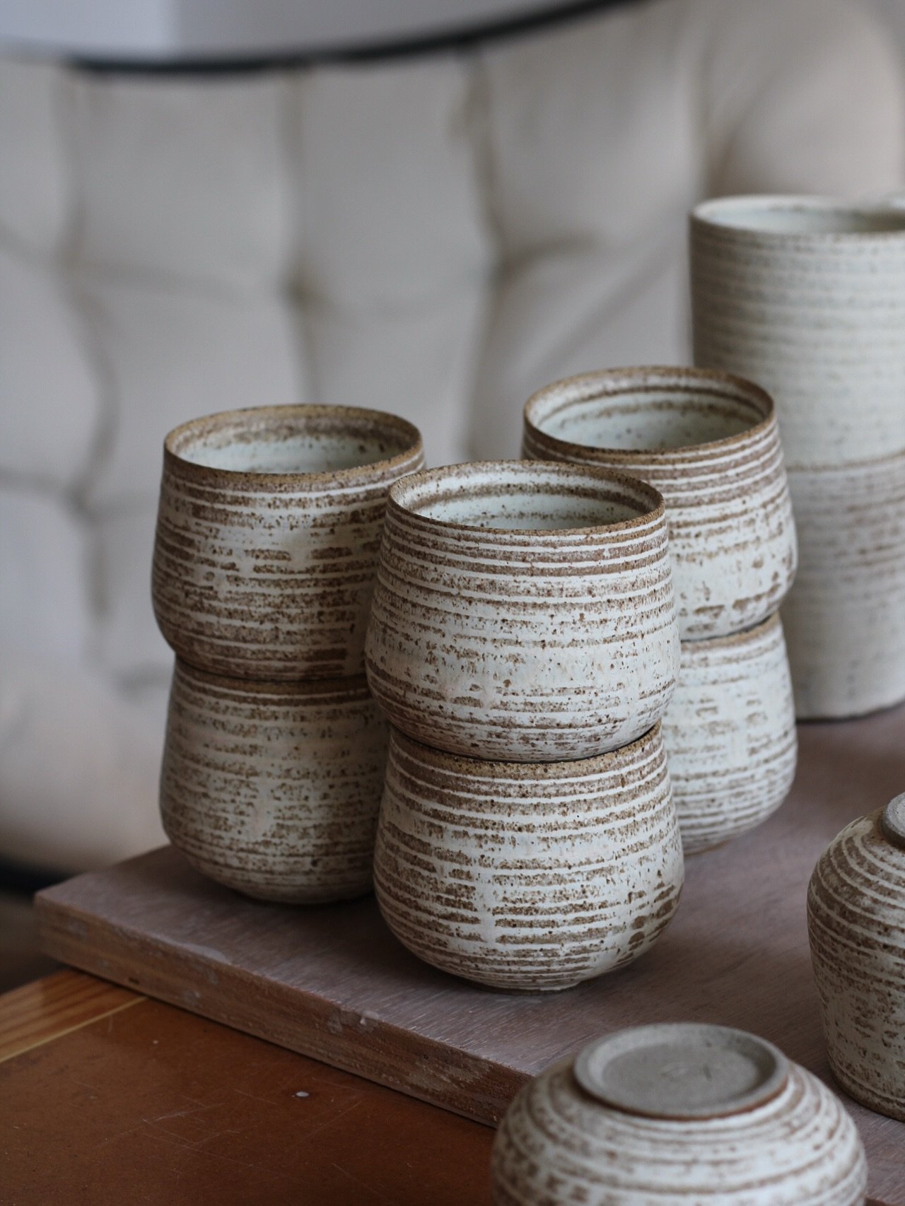 A fresh batch of cups for Artisan Roast in Edinburgh.

I tried thinning down the glaze a bit more for this batch. It settled into the trimmed ridges with a nice, natural run - less opaque, with more of the toasted clay texture peeking through underne