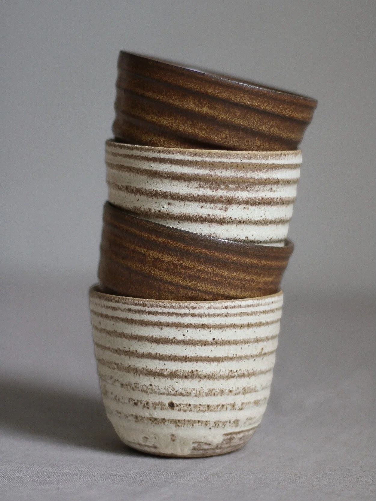 Some of my newest cups in Tamba and Dune ✨

#cup #mug #pottery #ceramics #handmadeceramic