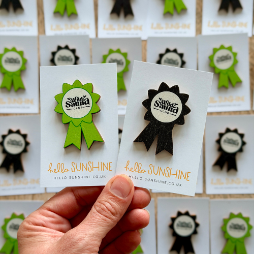 Wild Sauna Club branded badges.png