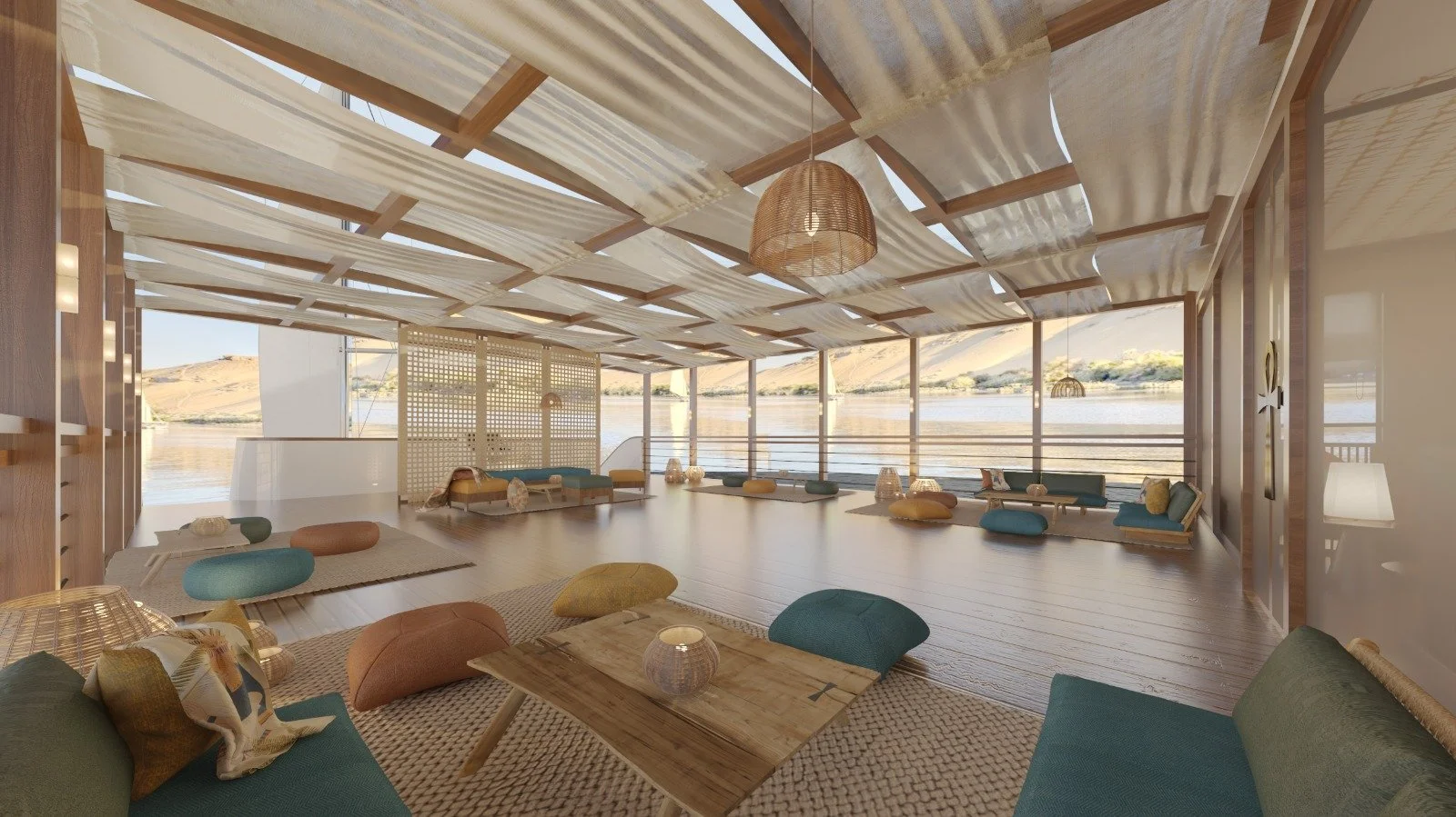 A boat with a large sail gliding through a river under a clear blue sky