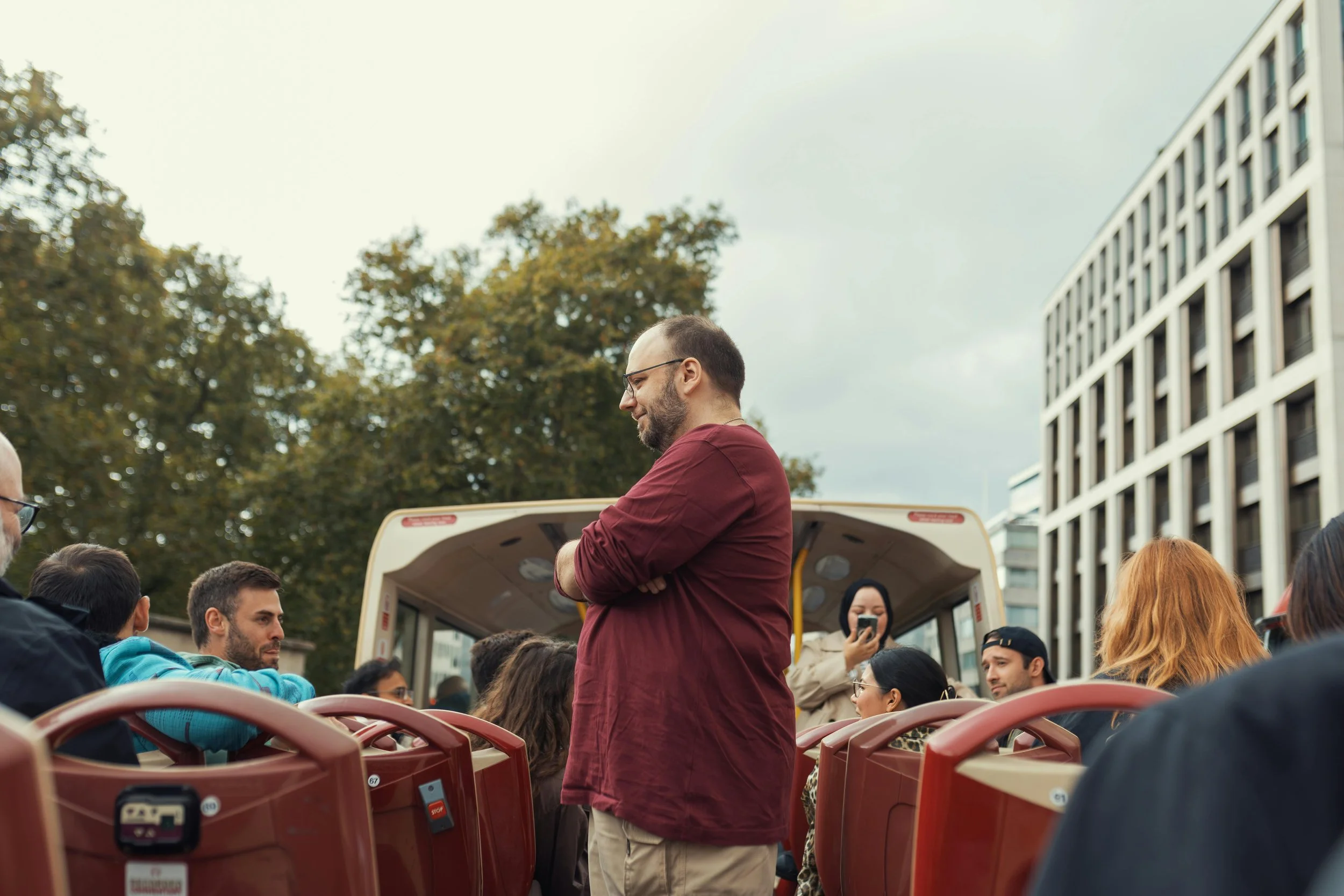 expert tour guide explaining history to group during walking tour in London