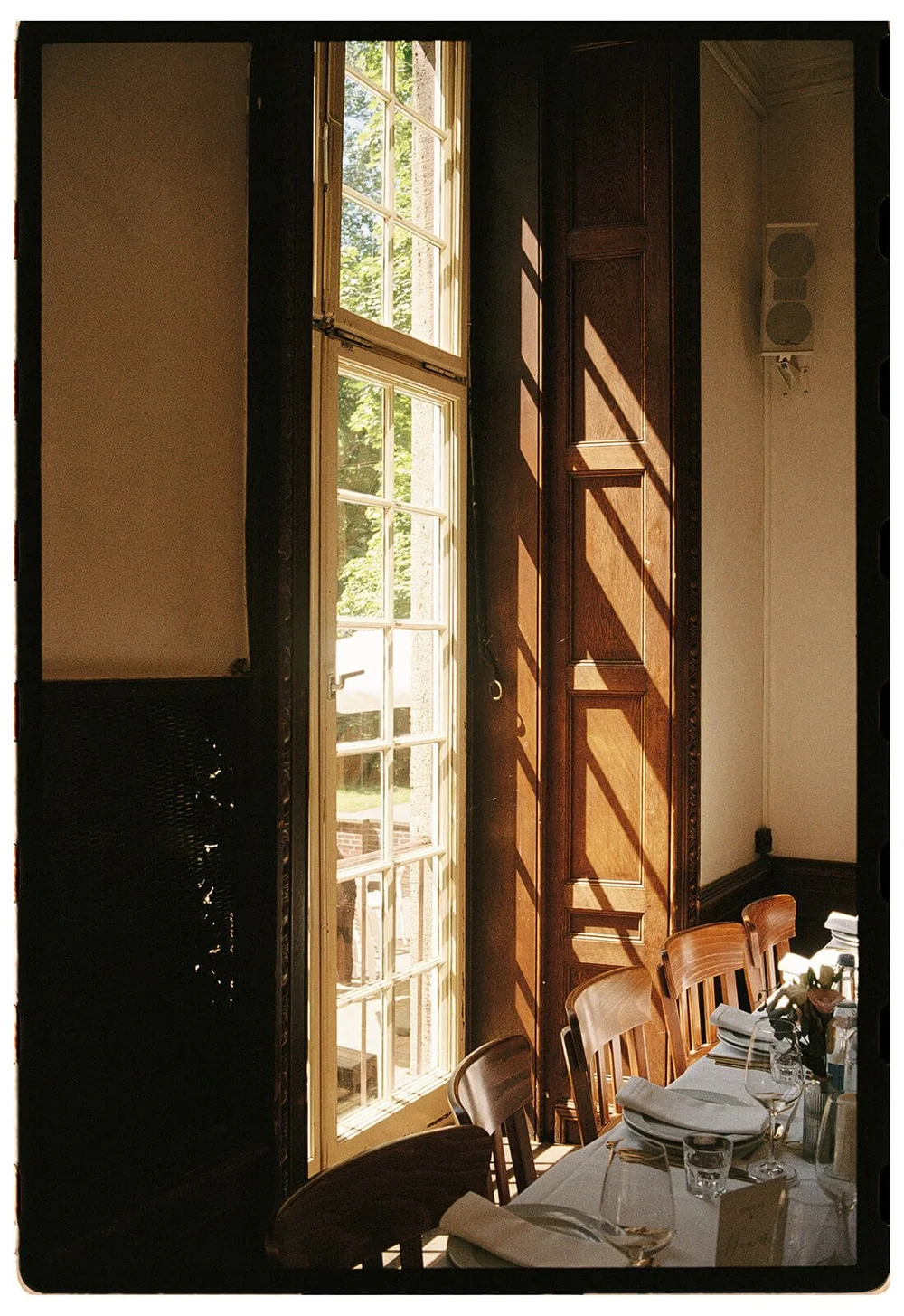 Late light falling through a tall window, on film