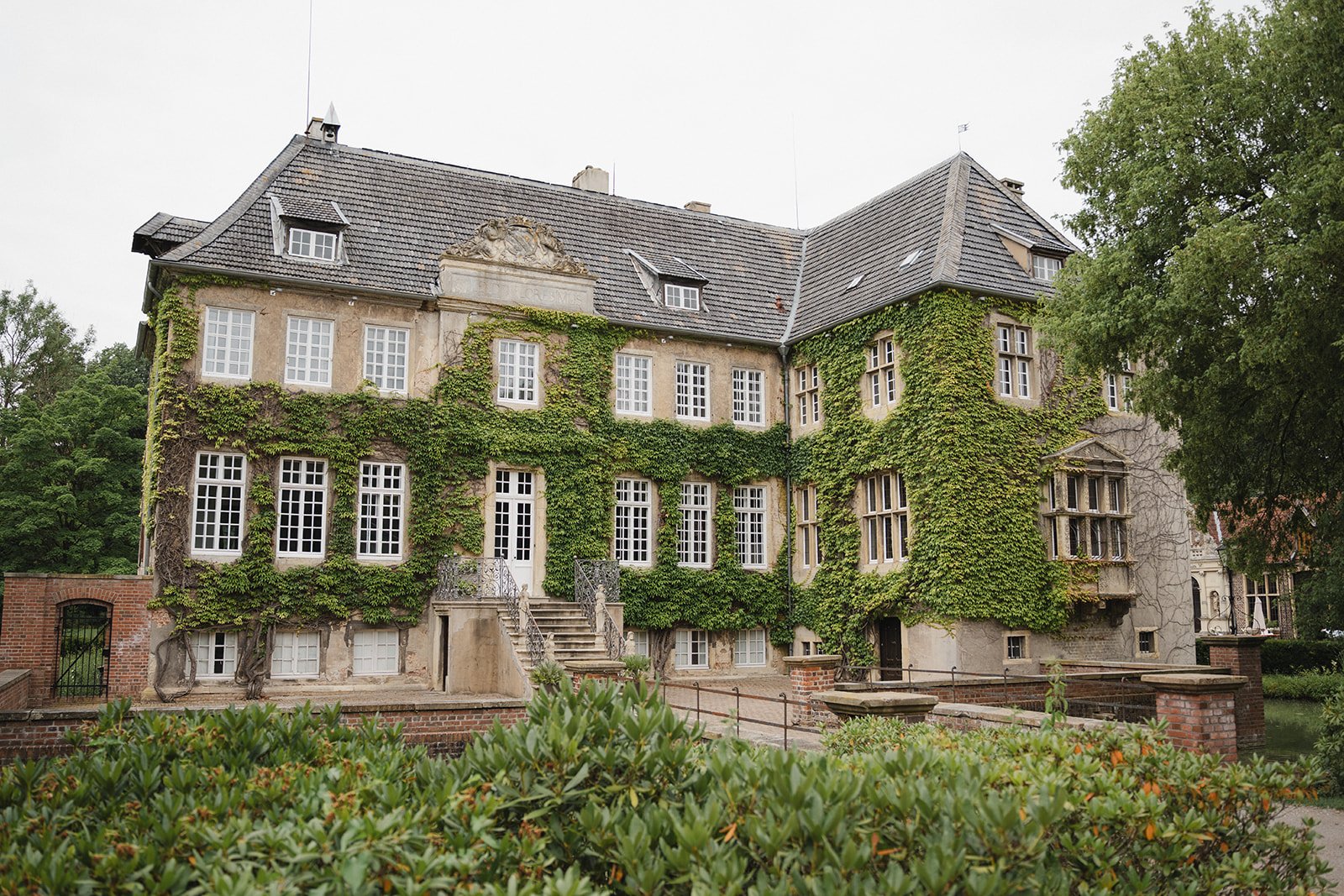 wedding venue exterior during a summer wedding celebration.jpg