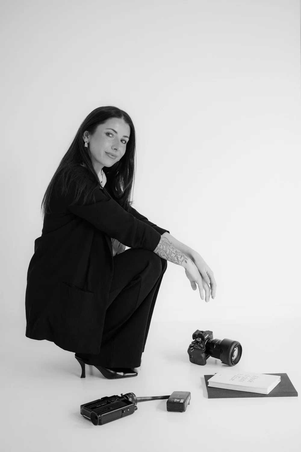Jenni Biddle with her camera and a Super 8 camcorder