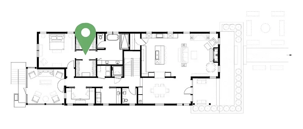 Floor plan of a house with an outdoor patio, several bedrooms and bathrooms, a living room, kitchen, dining area, and outdoor yard with garden.