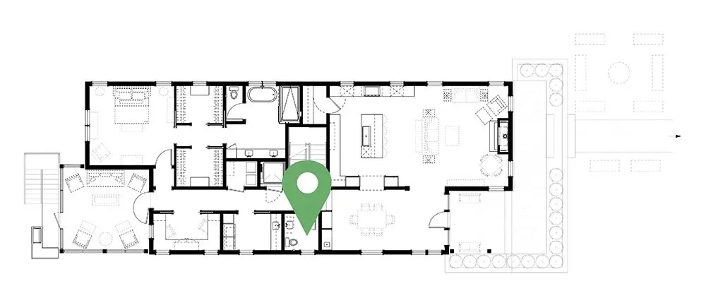 Floor plan of a house showing various rooms, with a green location marker in the center.
