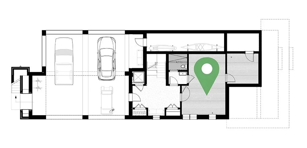 Floor plan of a house showing garage, bedrooms, bathrooms, and living areas with a green location marker in one room.
