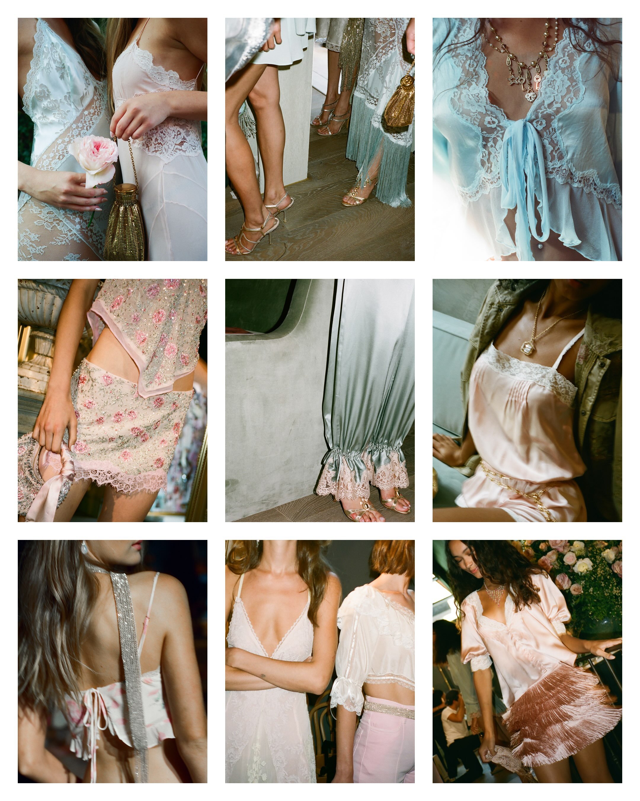 Close-up of women dressed in elegant, pastel-colored and lace outfits, wearing jewelry, at a fashion event or photoshoot.
