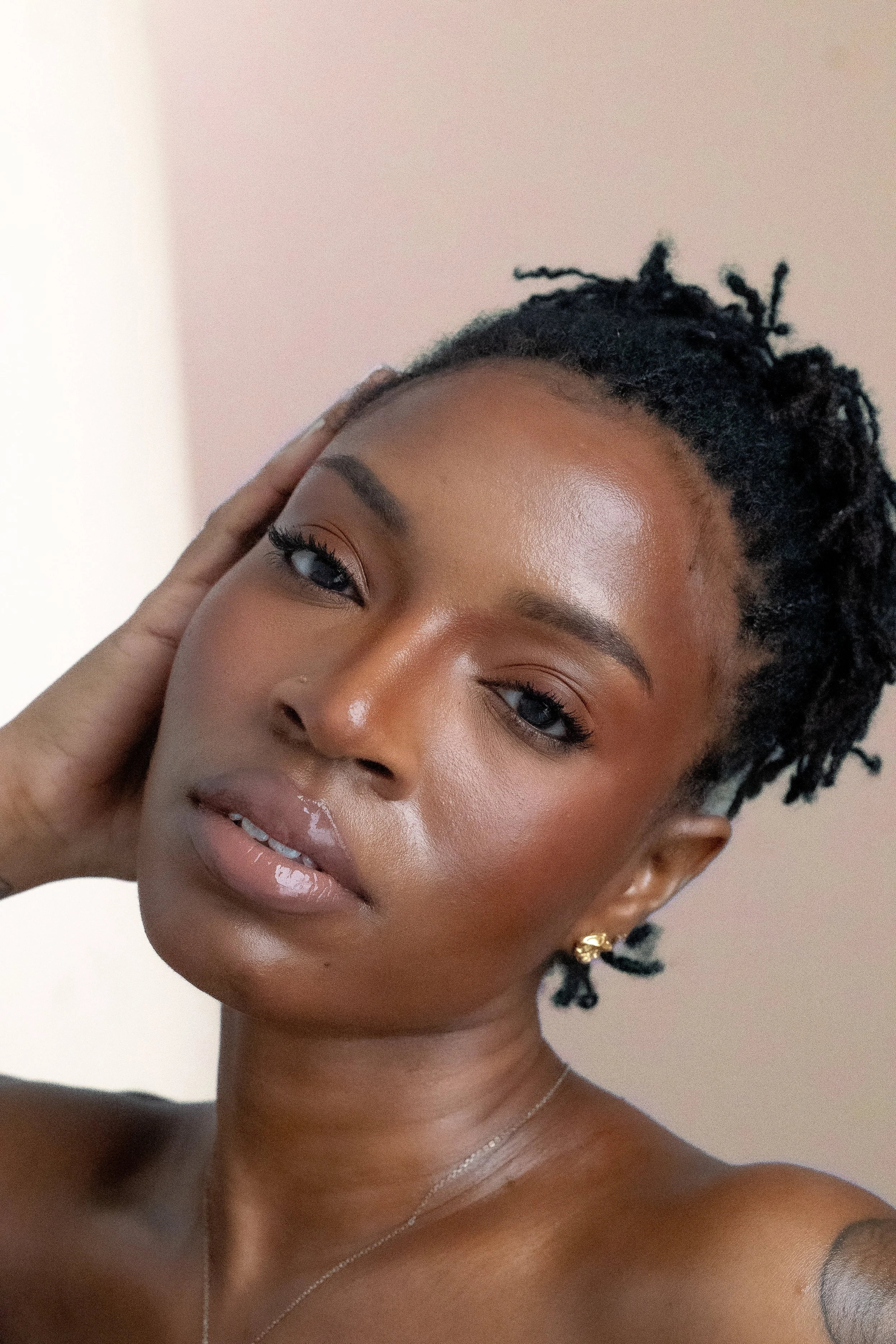 African American Woman with locs beauty shot peach background.jpg