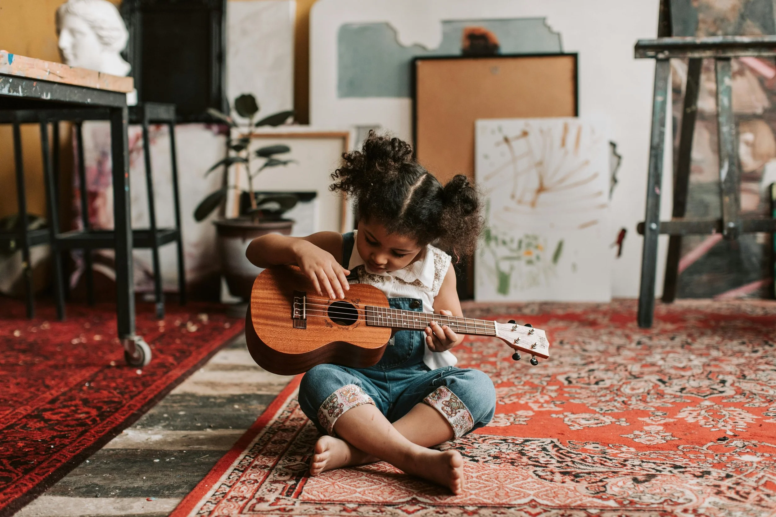 Child playing ukulele