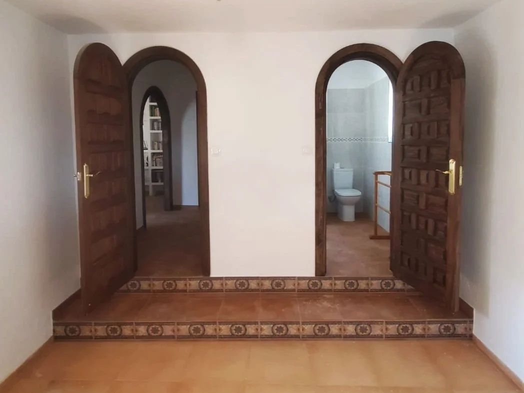 master bedroom with arch doors.jpg