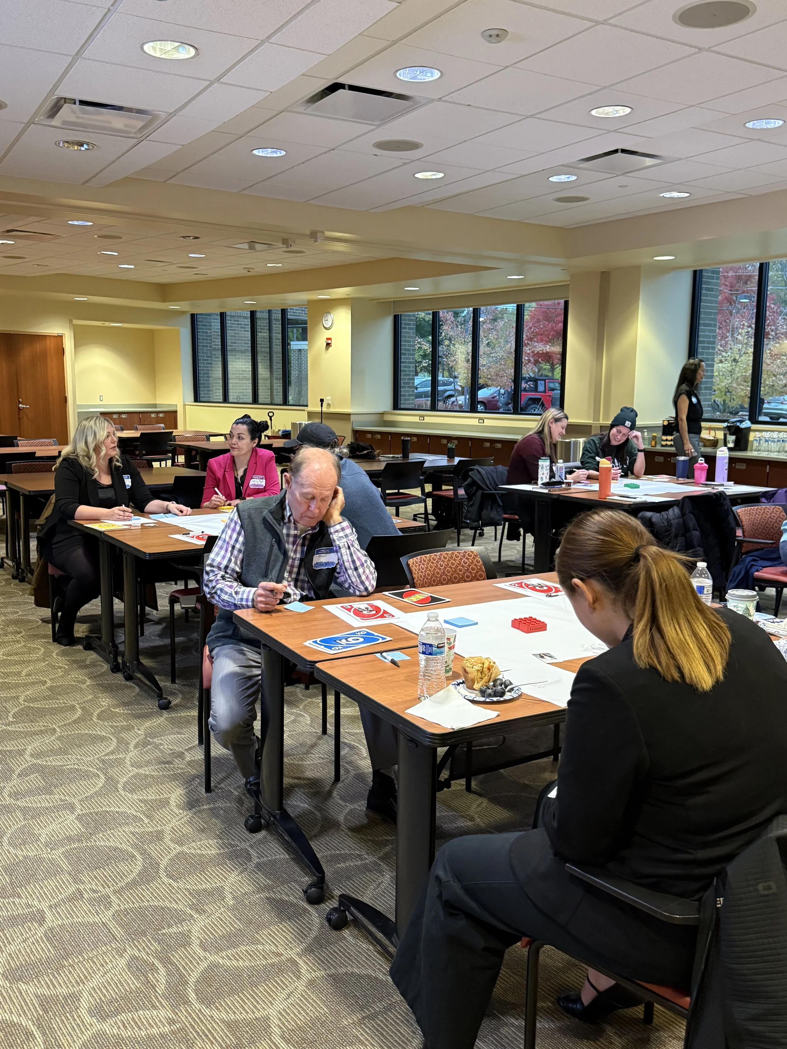 Business team completing reflective exercise during communication training