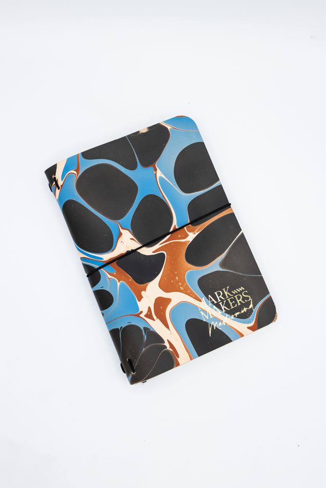Colorful abstract pattern notebook with custom stamp.
