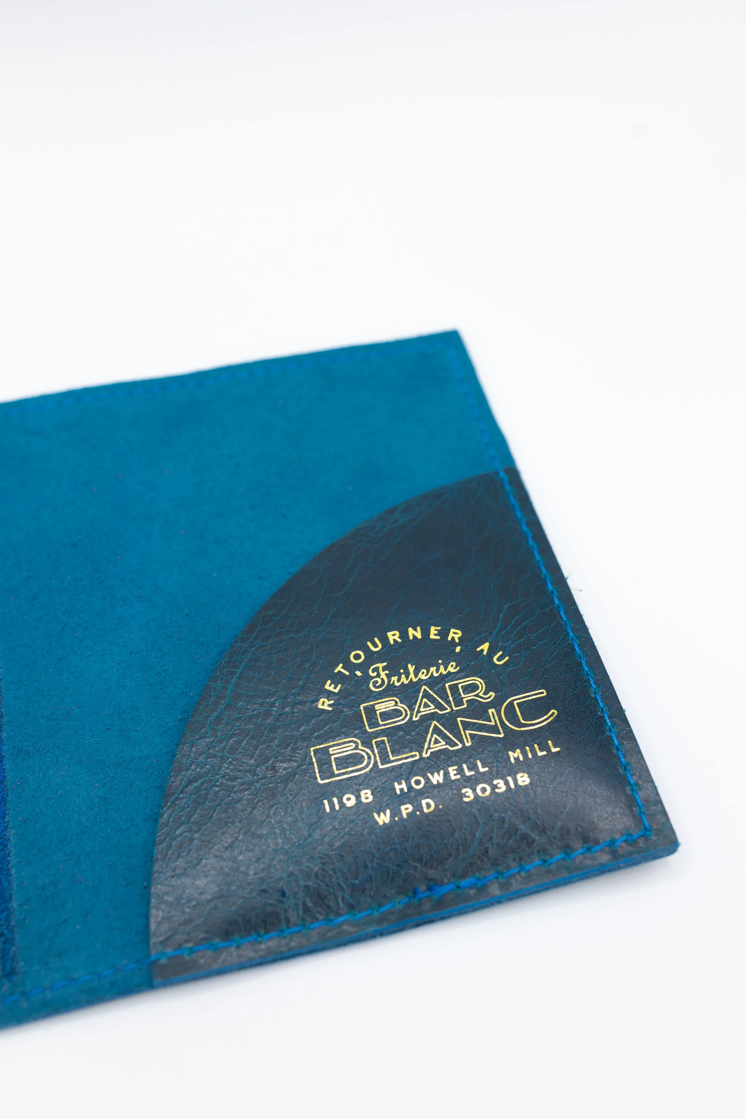 Blue leather check presenter with gold lettering. 