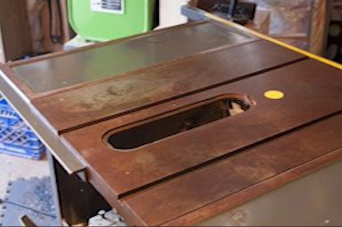 A rusted surface of a table saw