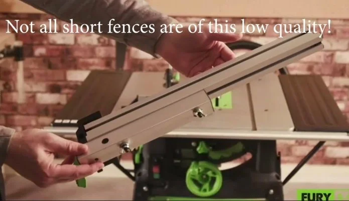 a pair of hands holding up a short table saw fence with a mobile table saw in the background