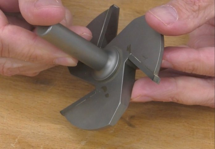 a pair of hands holding a 3-1/2 inch raised panel but upside down