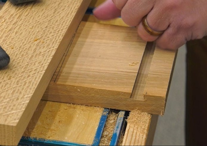 showing how the straight edge is offset from the line to create the tapering effect on the work piece