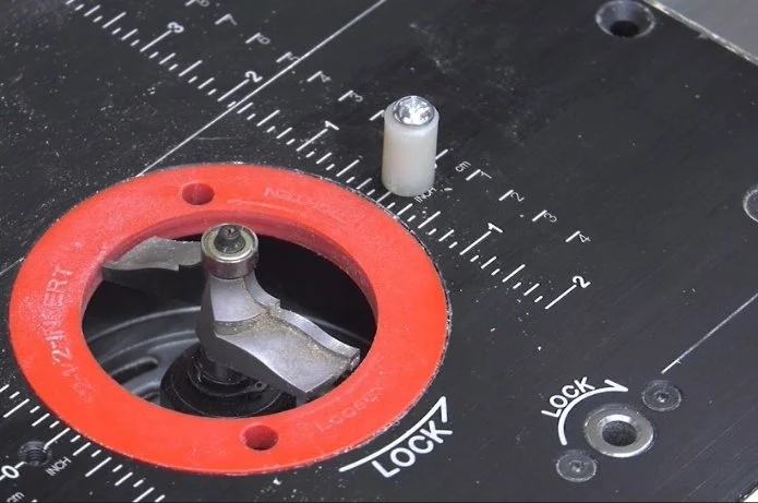 a starter pin screwed into a router table