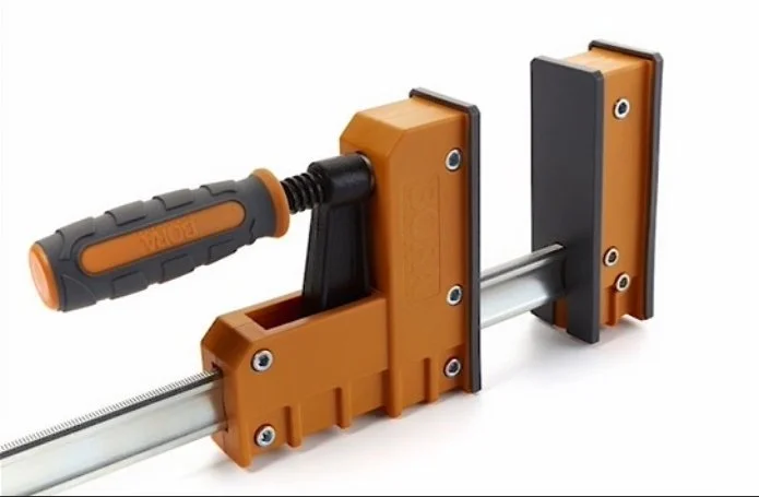 an orange and grey parallel clamp on a white background