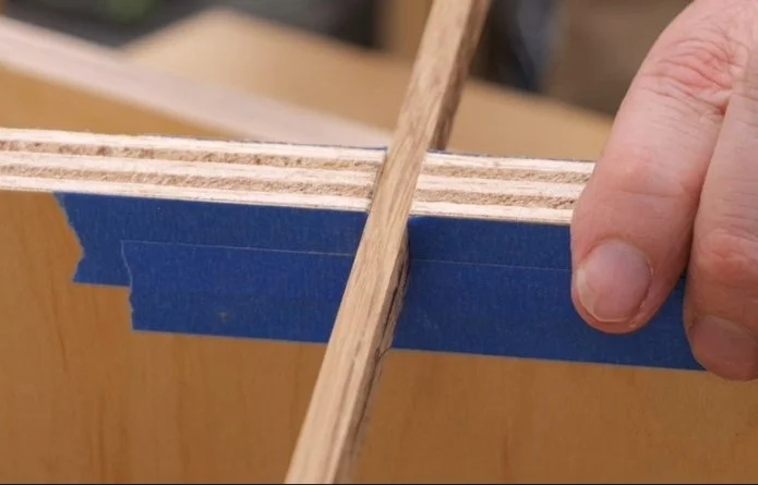 inserting a hardwood strip into the kerf cut a plywood piece