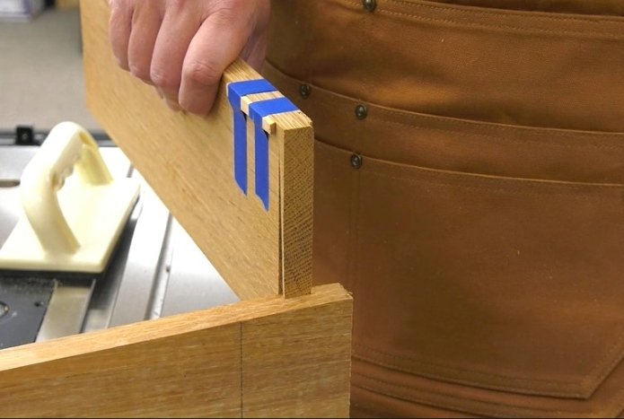 testing the fit of a sliding dovetail joint by sticking one piece into the other