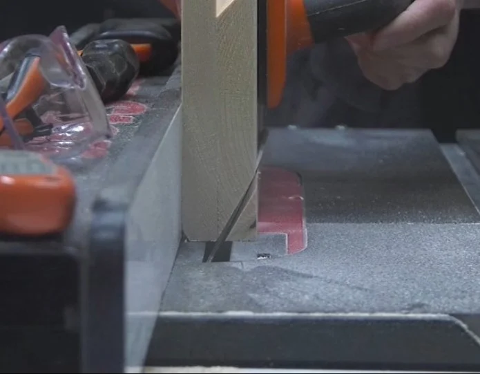cutting an acute angle on a table saw requires attaching a backing panel to your piece