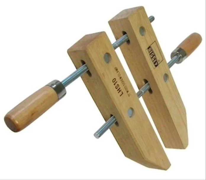 wooden hand screw clamps on a white background