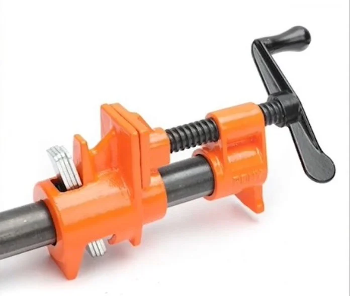 an orange pipe clamp on a white background