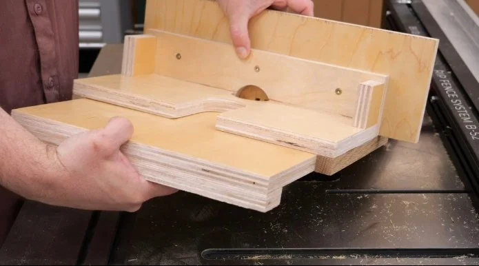 a piece of plywood cut to fit between the runners of a diy router table fence