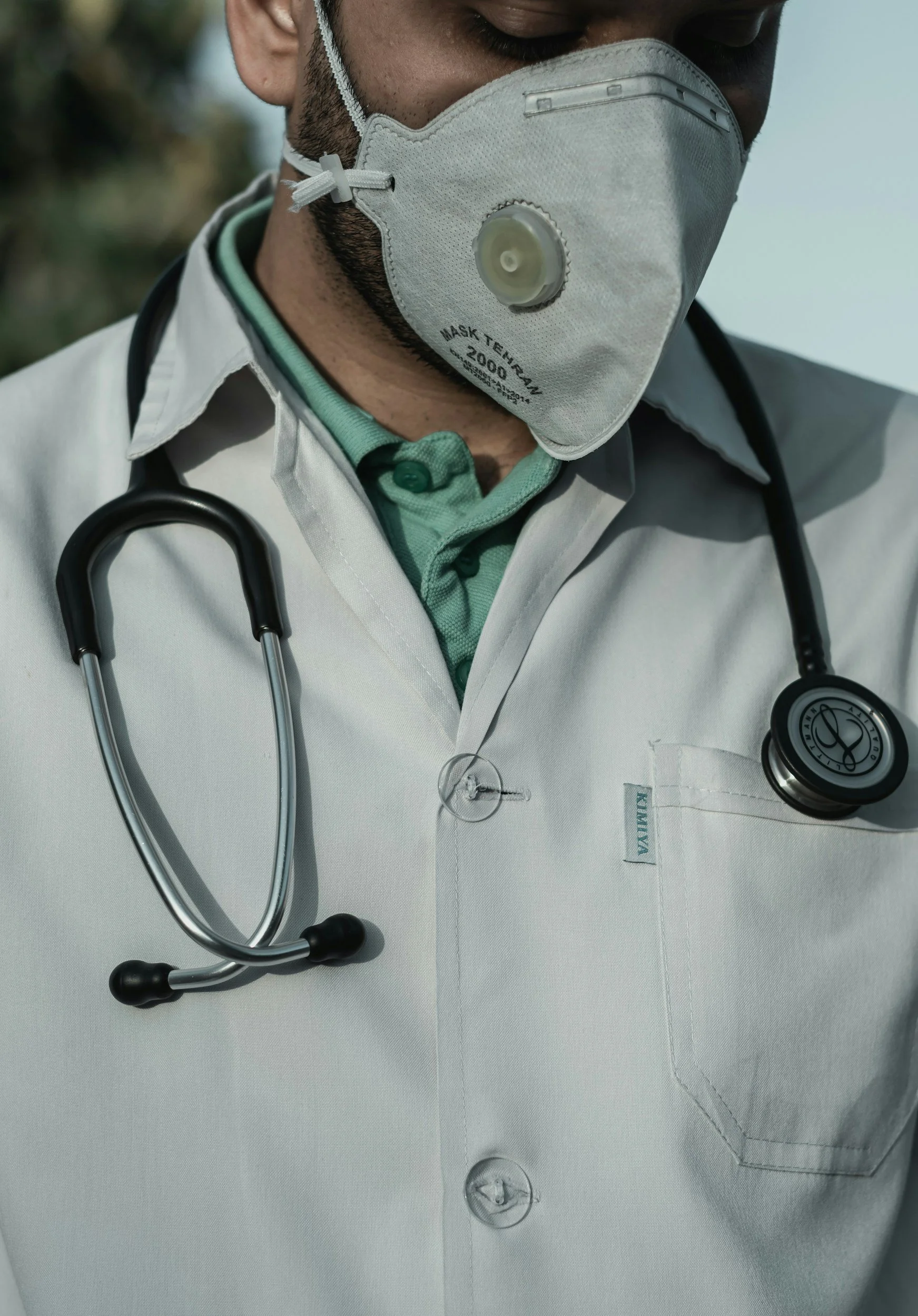 Medical professional with stethoscope representing clinical research and safety of photobiomodulation therapy.