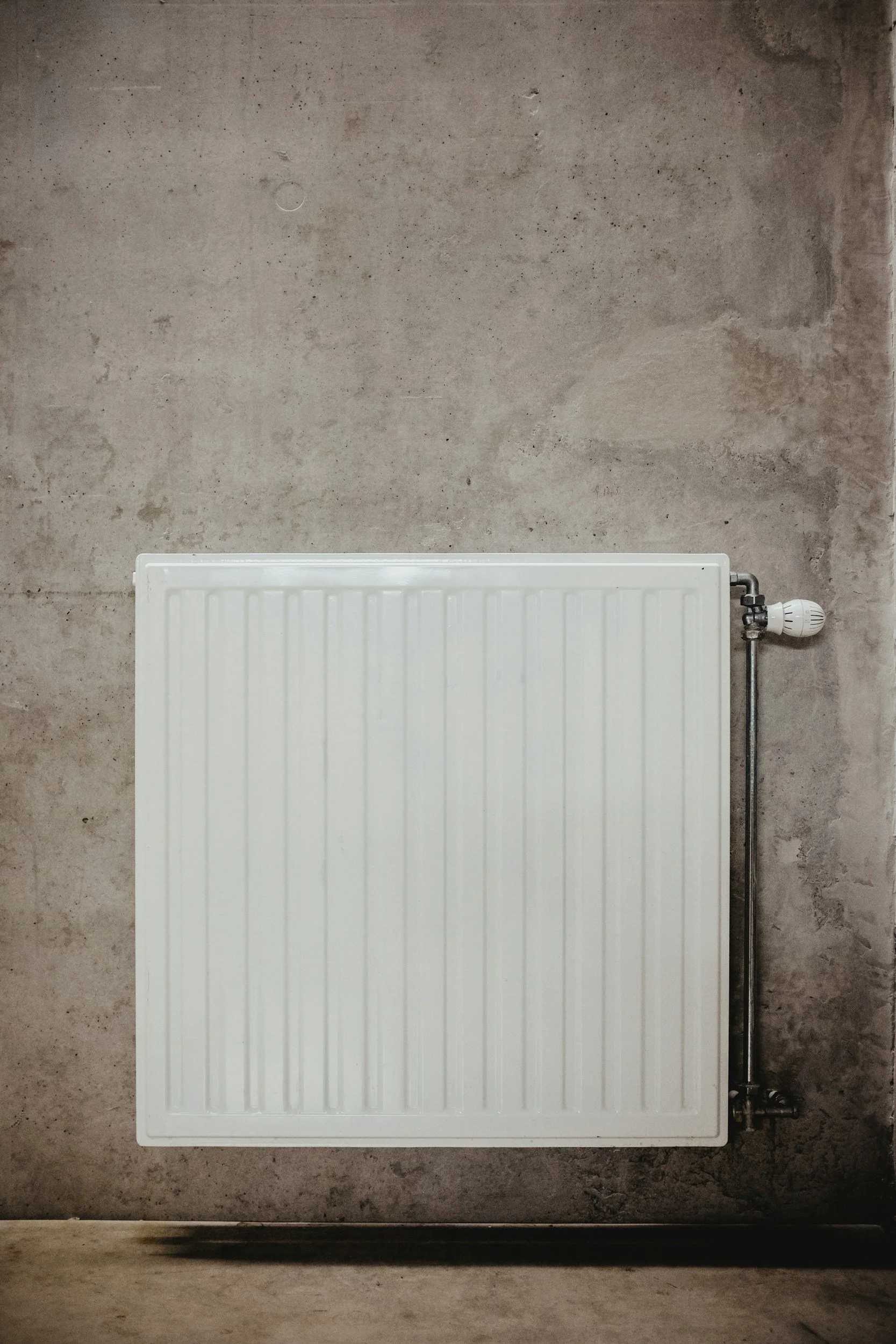 Close-up of a home radiator symbolising heat and energy transfer, concept for red light and infrared therapy.