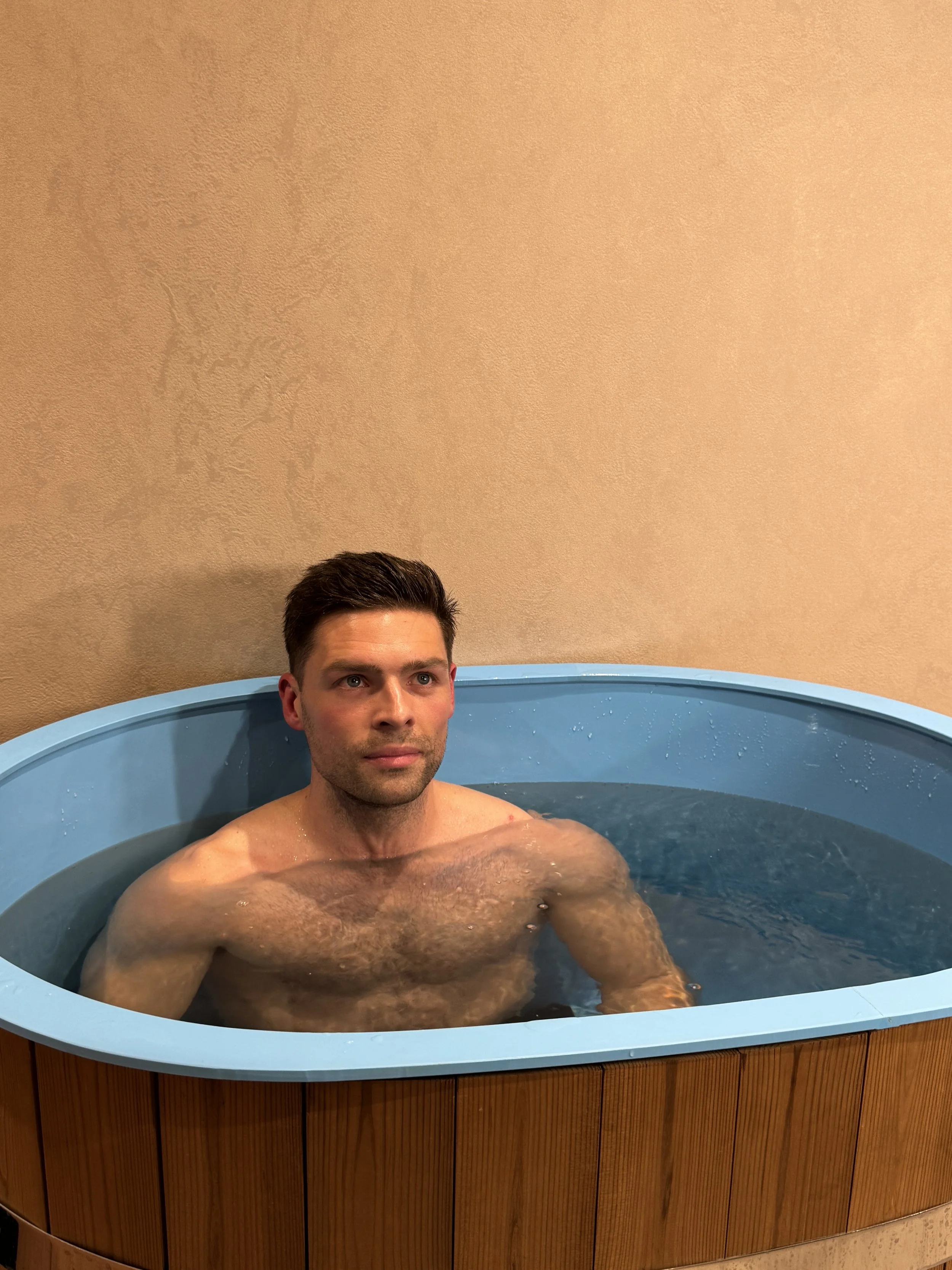 Man using Ice Bath Co cold plunge as part of contrast therapy at ReGen Rooms