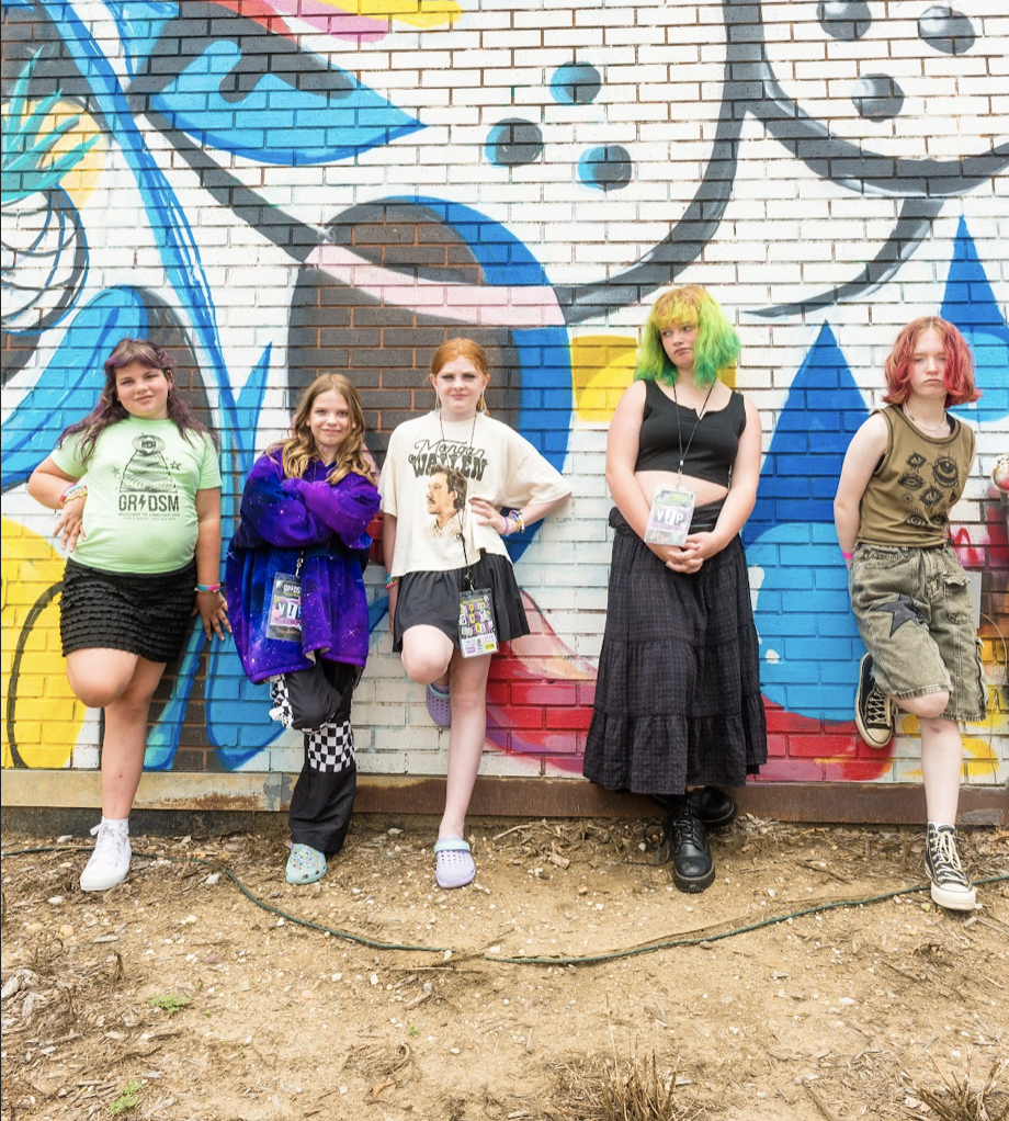 A Girls Rock Des Moines Summer Rock Camp youth band group photo outside of xBk.