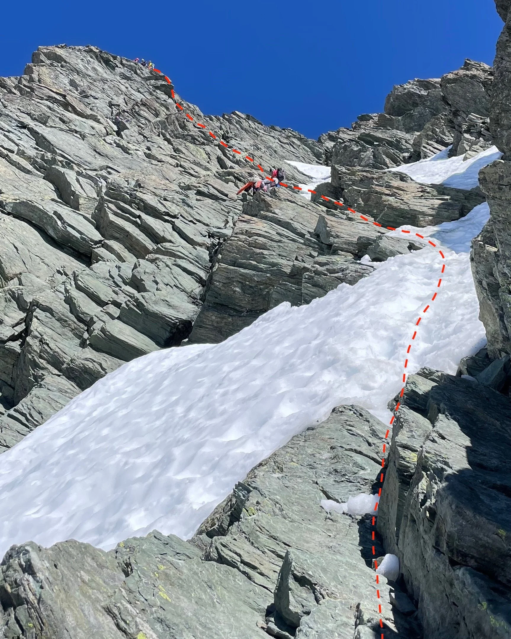 Halfway down the descent, looking up at the two rap stations and scramble.