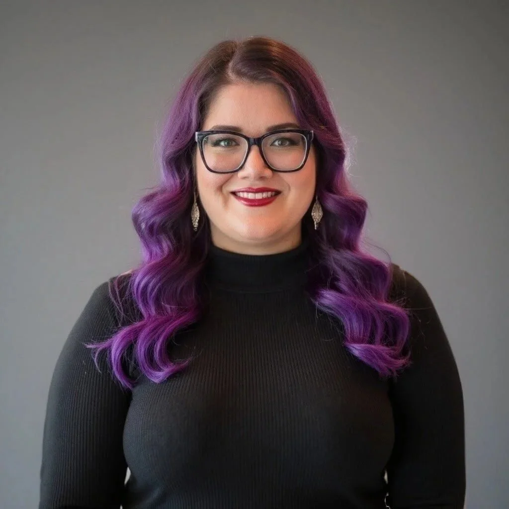 Business operations manager crystal wearing a black shirt standing in front of a grey background