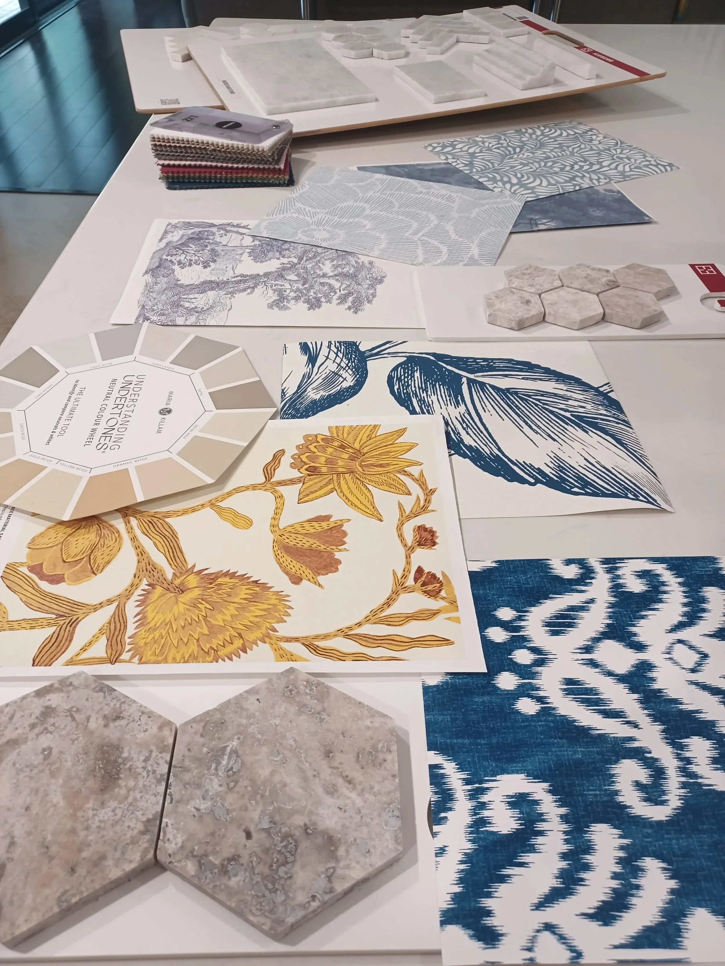 work bench full of design materials for a client