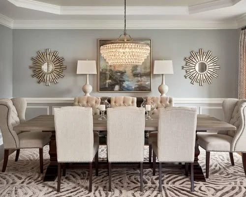 modern dining room in tampa bay with blue-gray walls and crystal light fixture