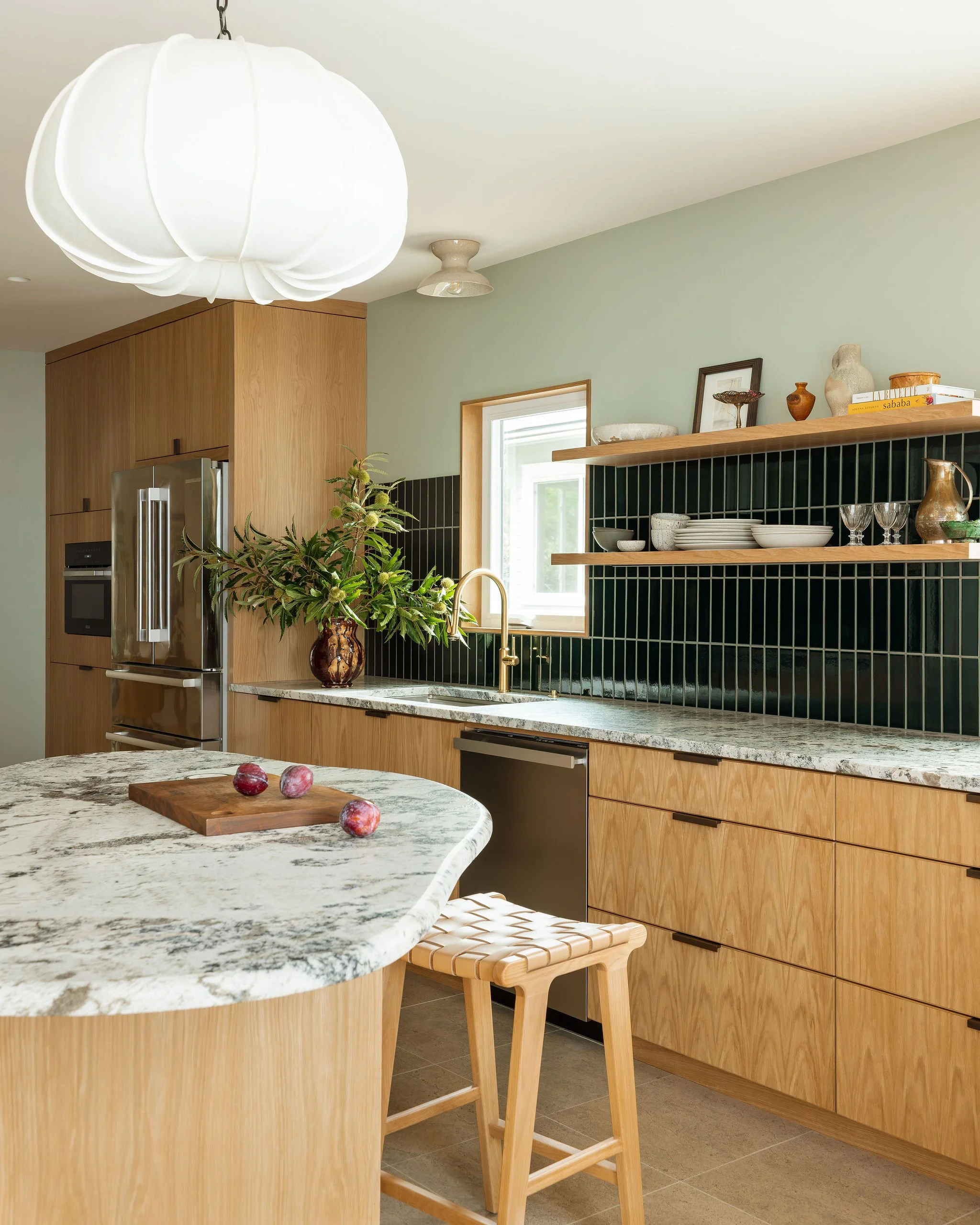 ModernOrganicKitchenRemodel_CurvedIslandNaturalStone.jpg