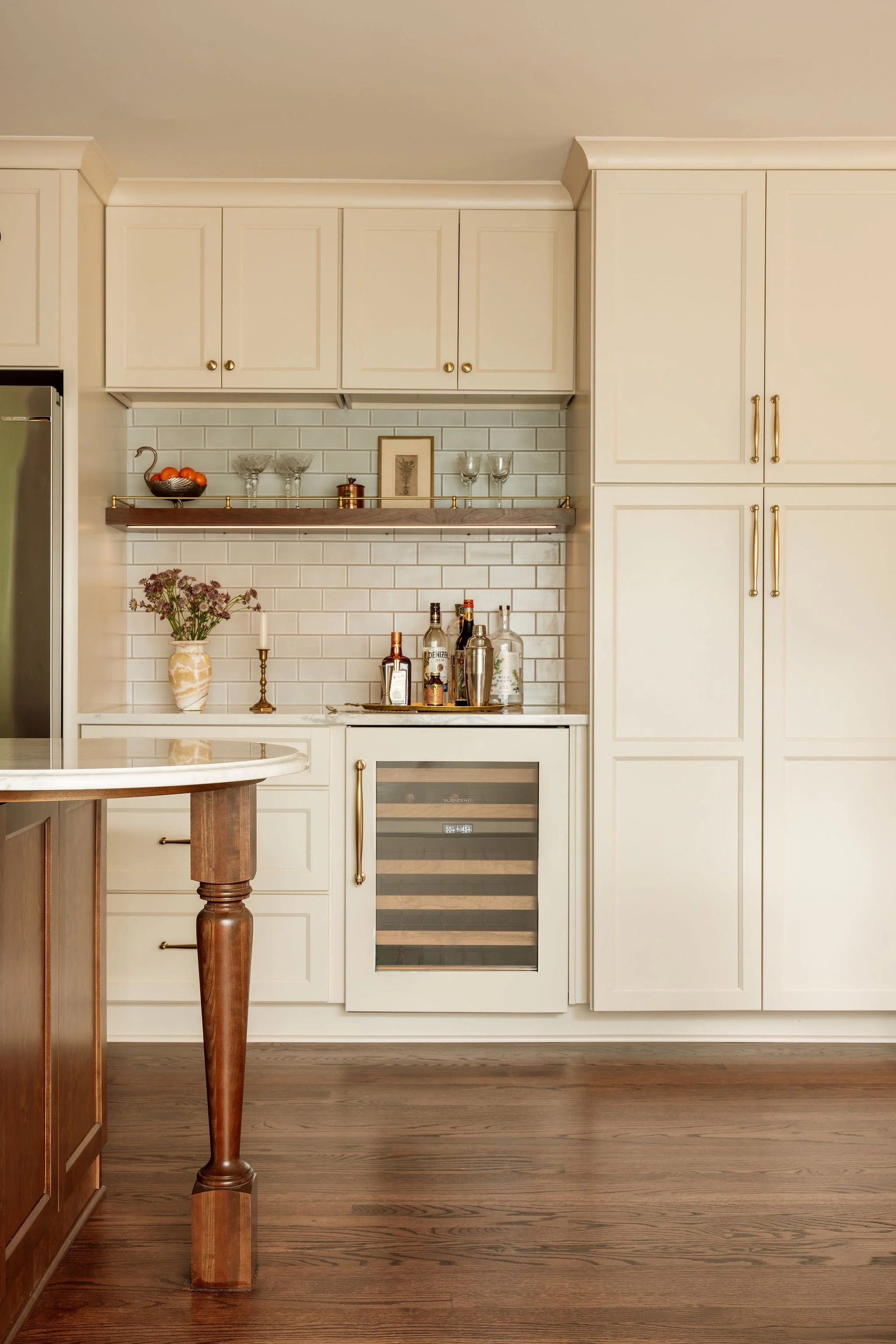 JennaDegenInteriors-Rittenhouse_Kitchen Rounded Island Decorative Leg and Bar 11.jpg