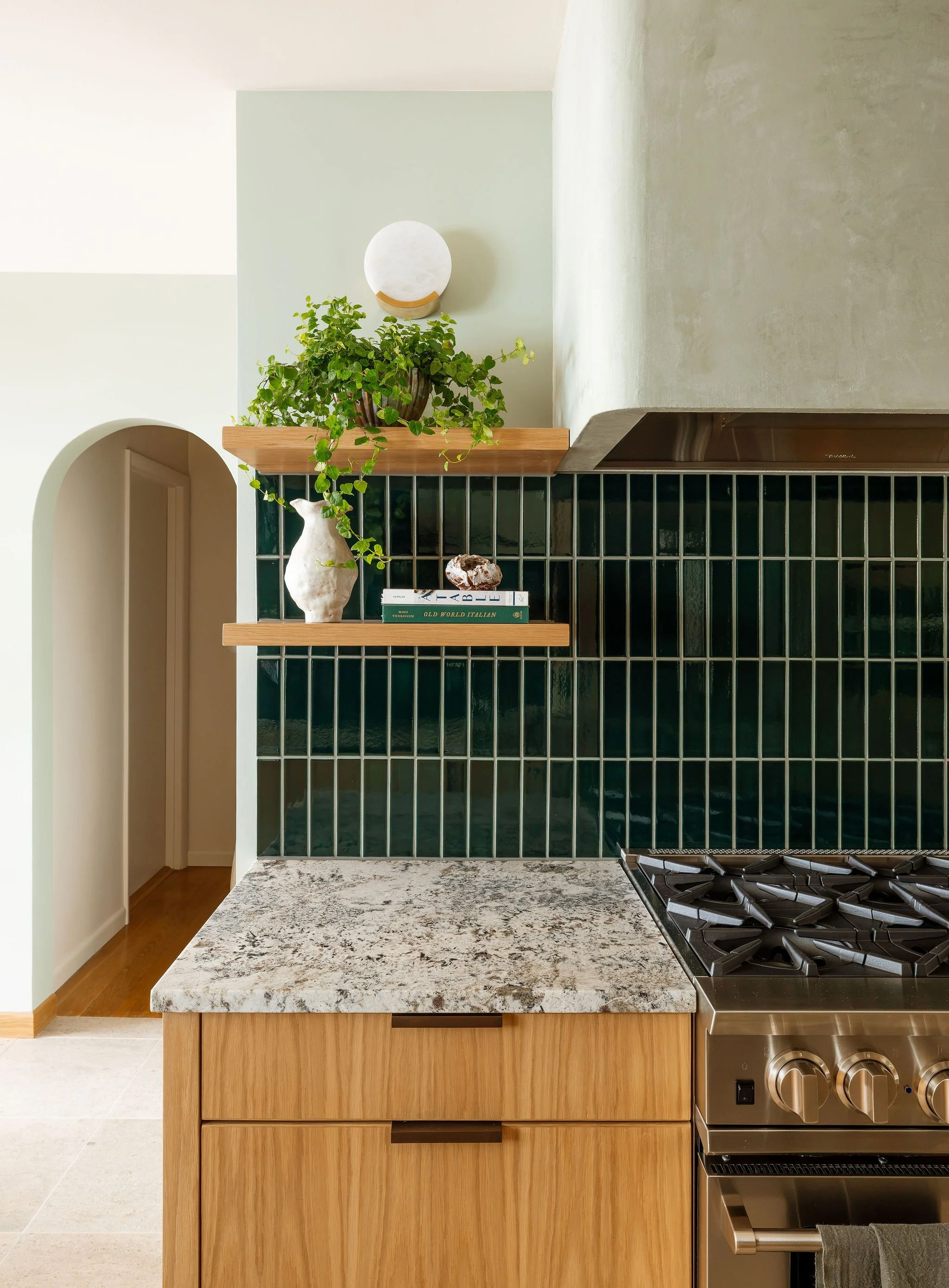 ModernOrganicKitchenRemodel_GreenTileModernHood.jpg