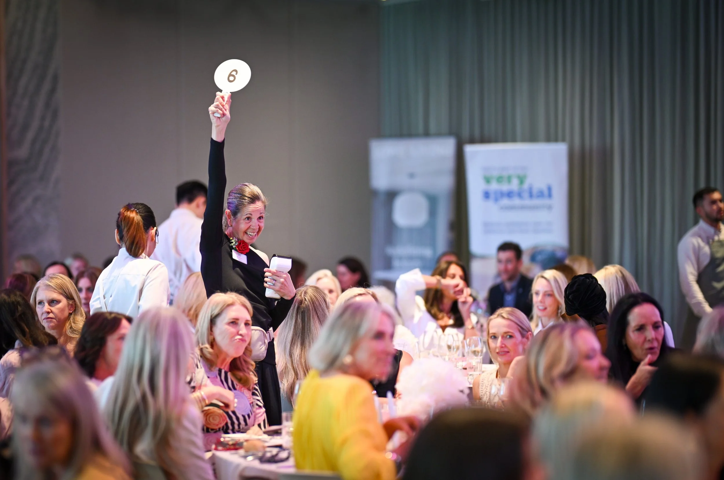 Photo of charity auction at Very Special Kids ladies lunch hosted at Zinc at Fed Square