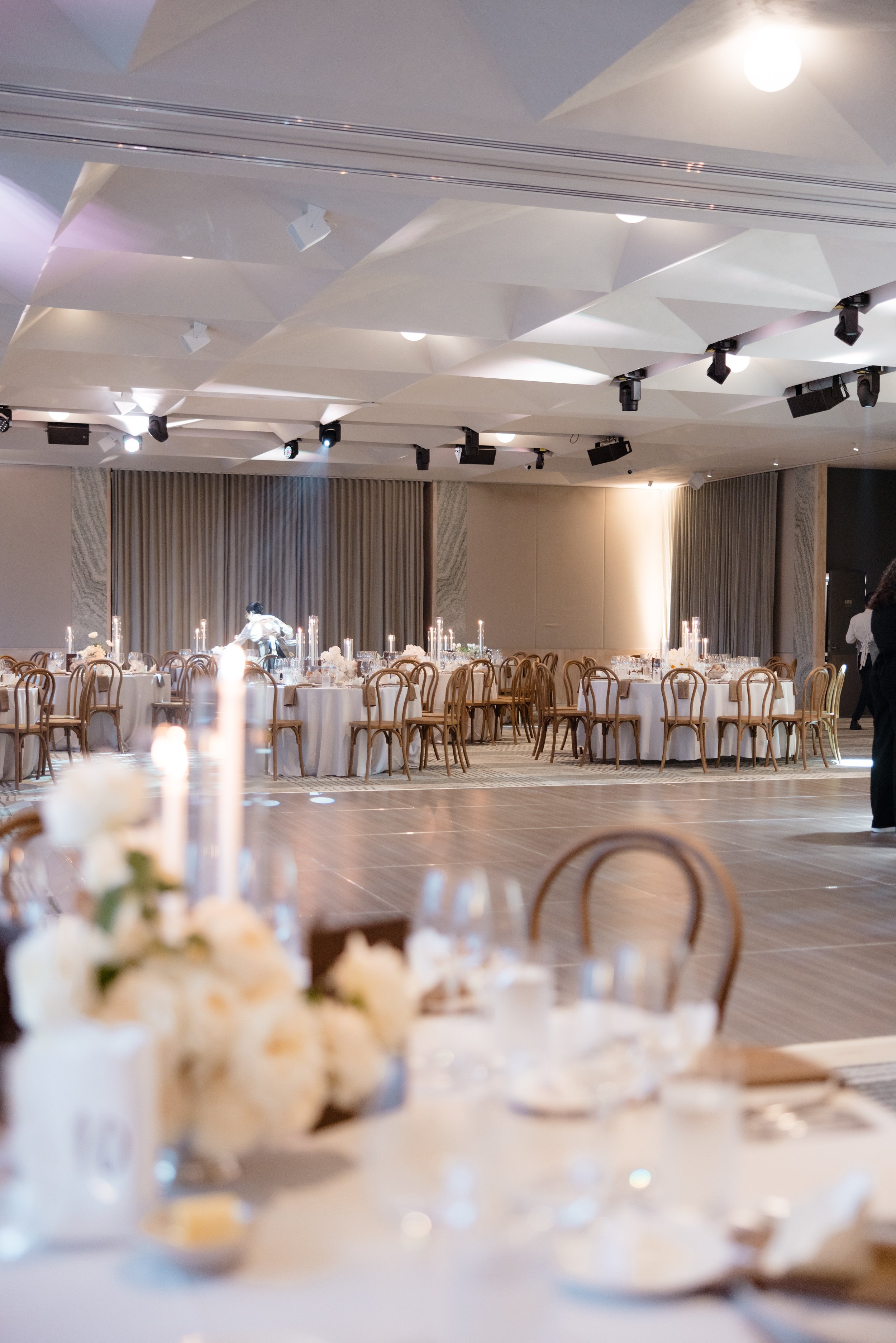 Floorplan of round tables around a dancefloor with head Bridal table against draped backdrop. 