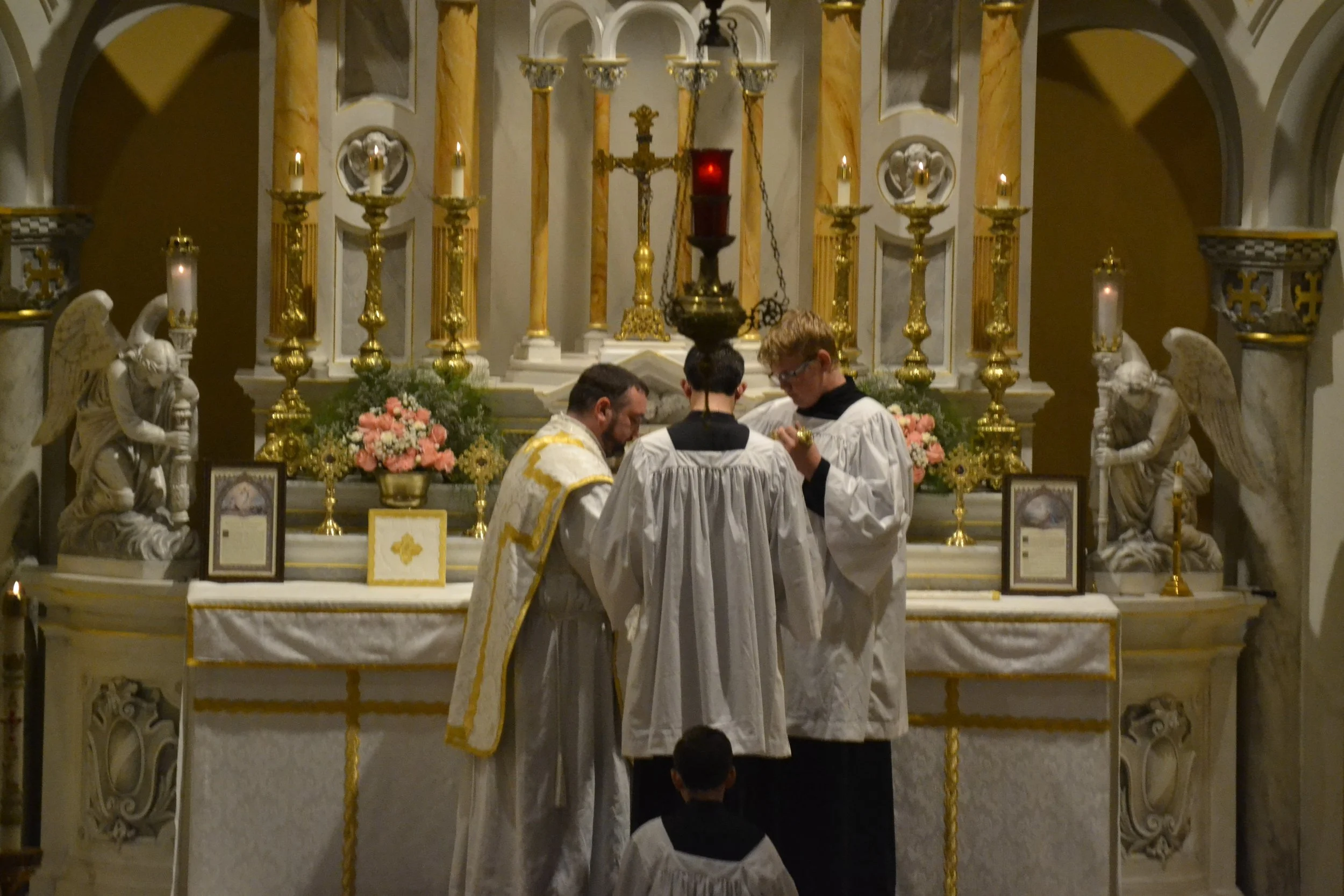 FSSP priest and servers at altar during the Offertory Traditional Latin Mass