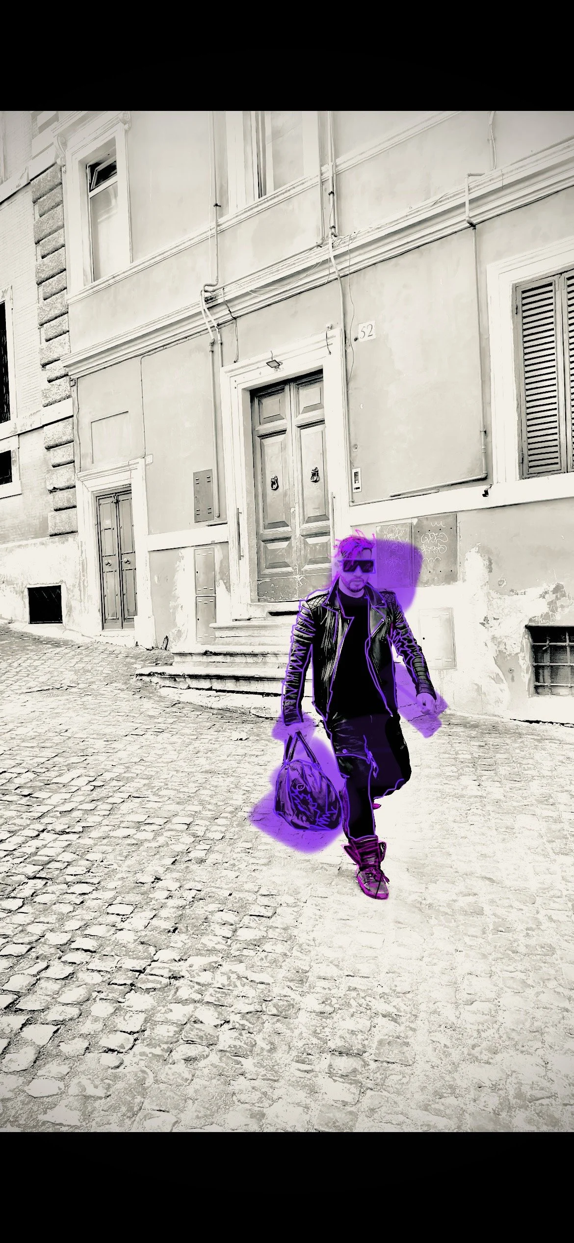 A person walking on a cobblestone street, wearing sunglasses and a leather jacket, carrying a bag, with a purple outline and a digitally added purple shadow, in front of an old building with stairs and a wooden door.