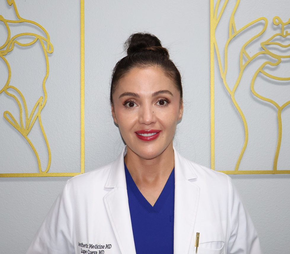 Dr. Lupe Cueva in white coat in office