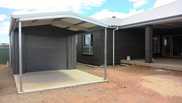 single door shed with awning at the front