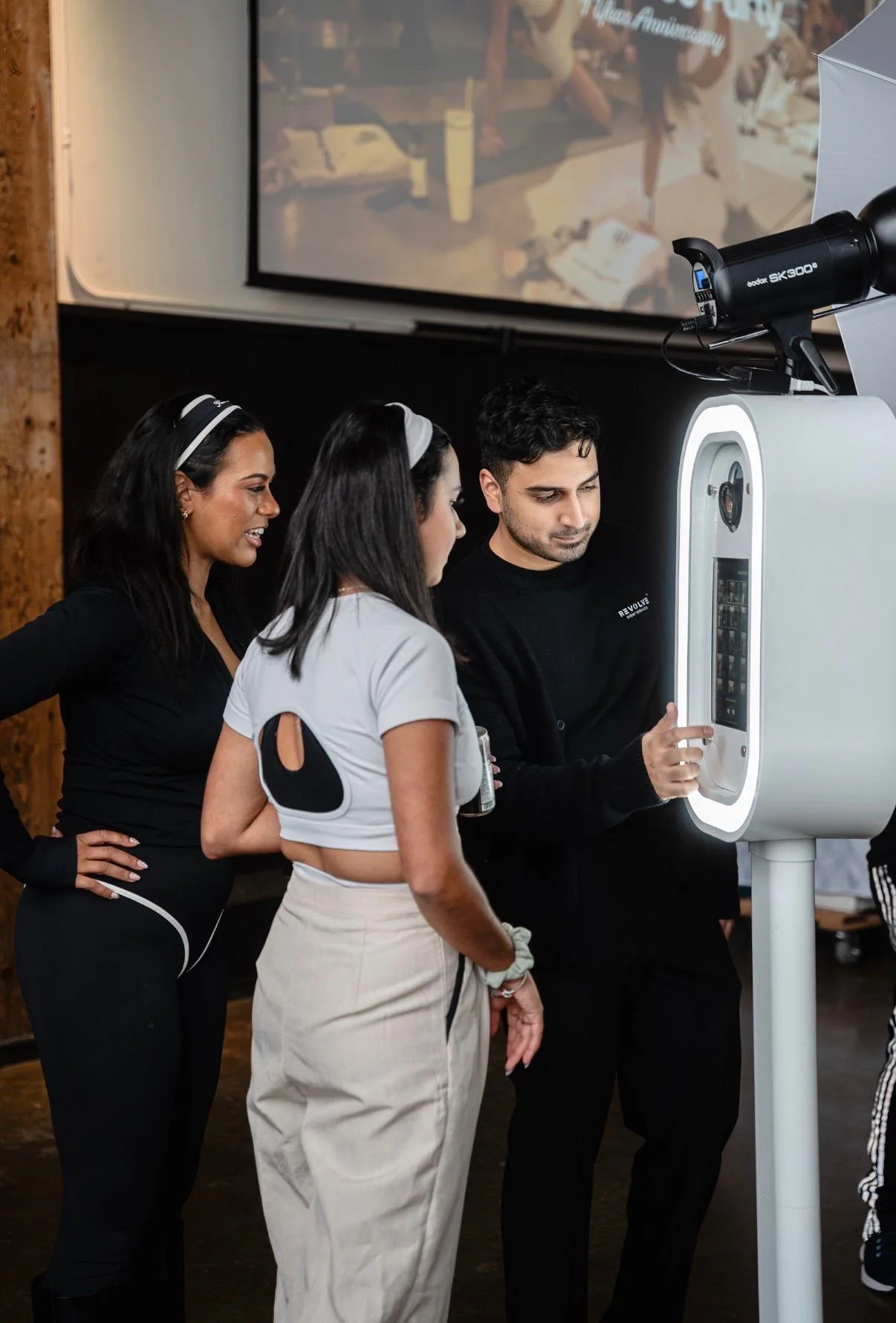 Professional photo booth attendant at Toronto event by Revolve Event Services